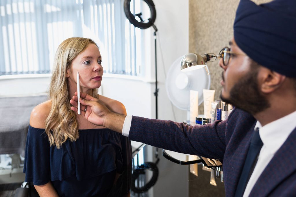 Patient receiving full face filler treatment