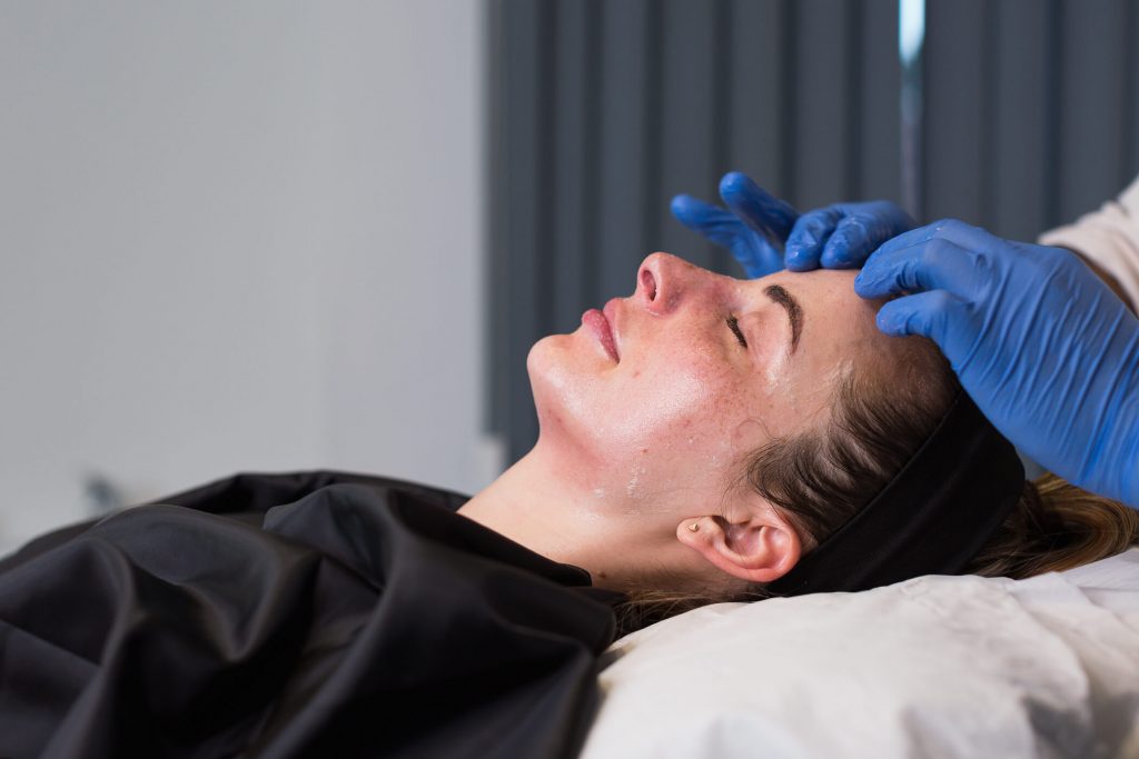 Patient undergoing face peel treatment