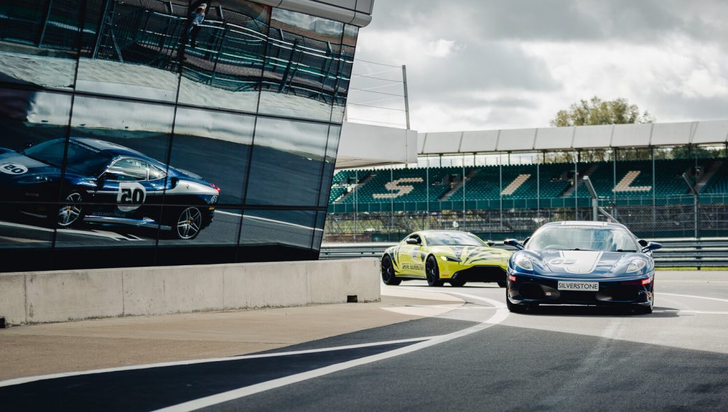 Ferrari and Aston Martin coming into the pit lane - Silverstone circuit