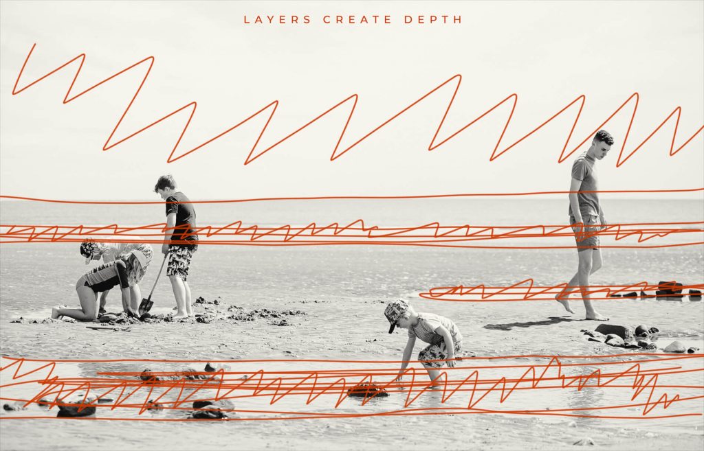 The sky, sea, beach and pools of water create interesting layers of texture that are compressed by the longer lens adding visual interest and depth to the image.