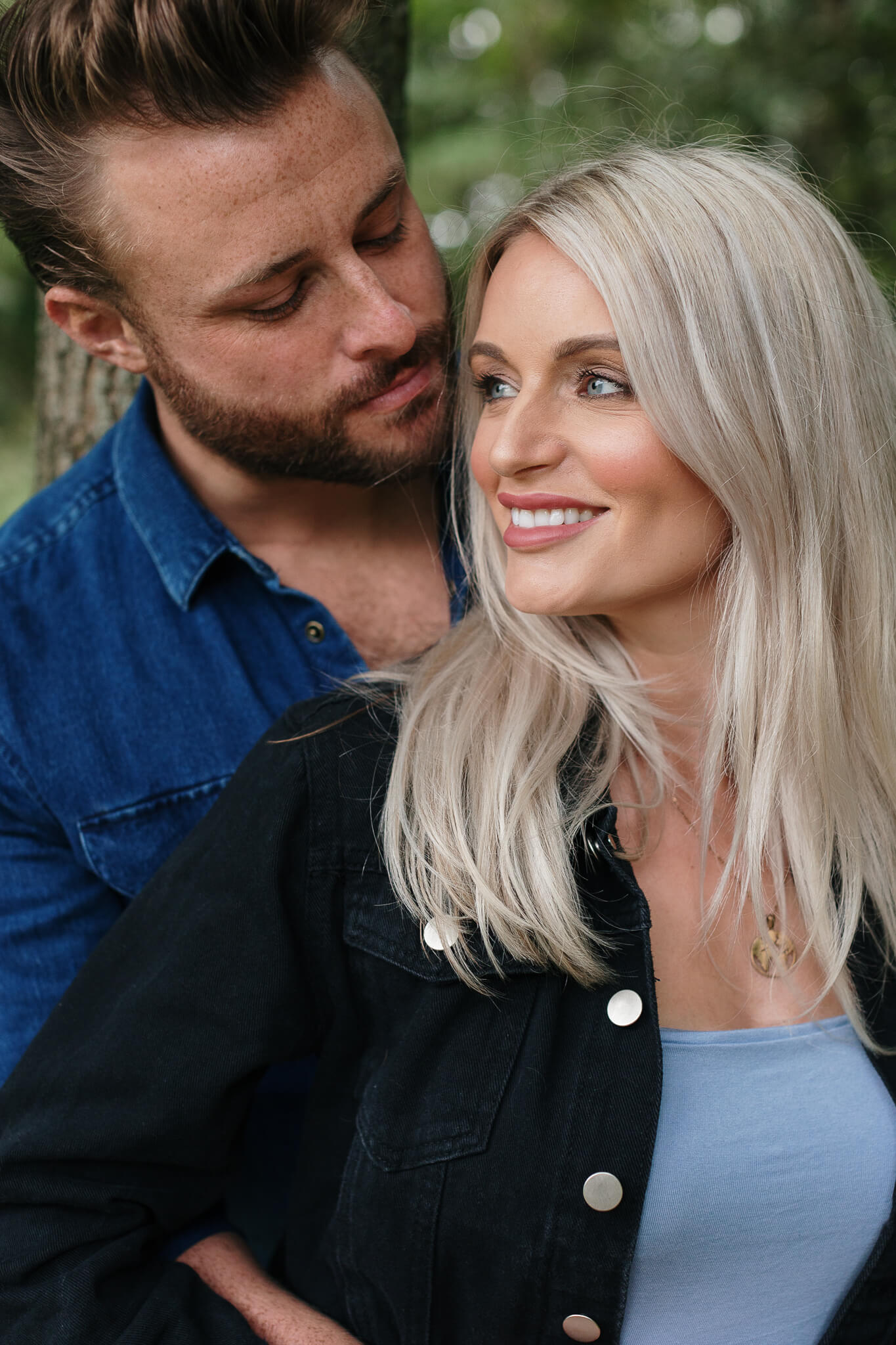 Natural light portrait of a happy couple at Golden Acre Park, Leeds