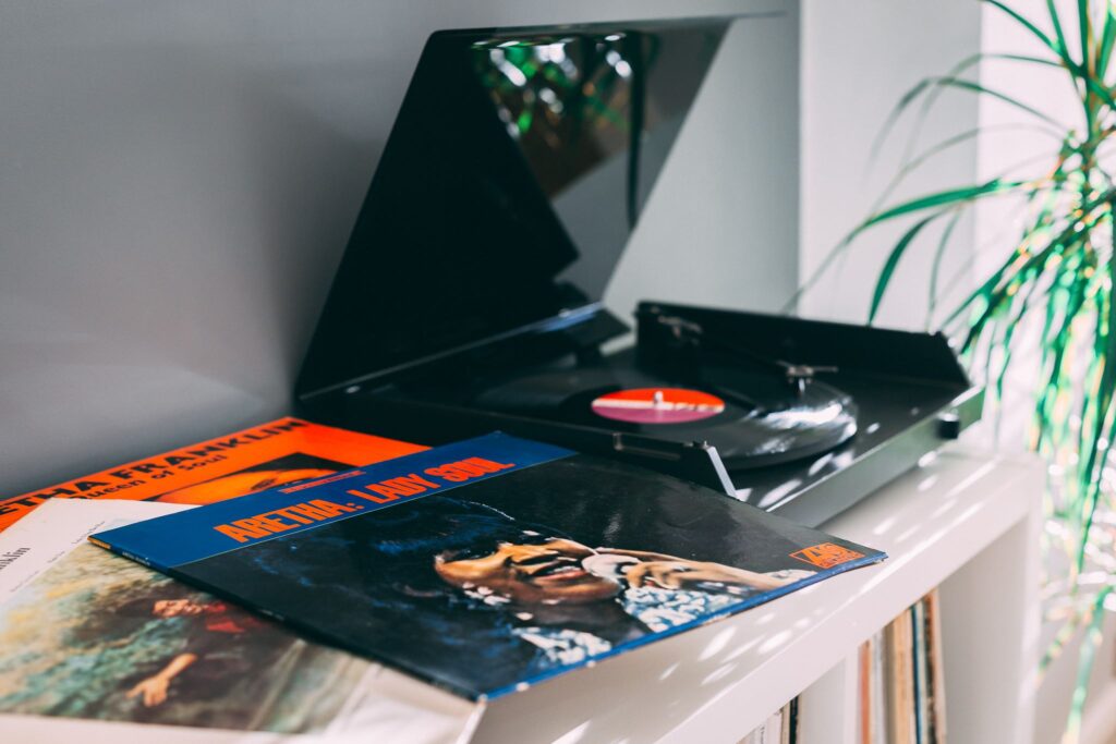 Record player with a selection of Aretha Franklin records