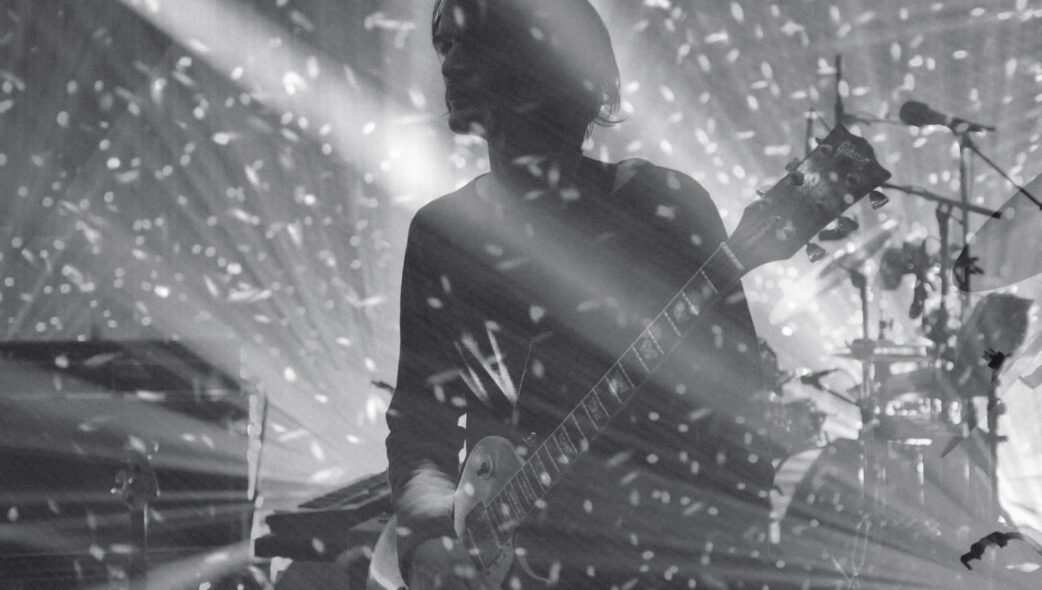 Greenwood’s brother and bandmate, Jonny Greenwood, performs onstage in Dublin, Ireland, in 2018. Photos such as this feature the “random chaos of all the lights and the noise” of the band’s live performances, the photographer said.