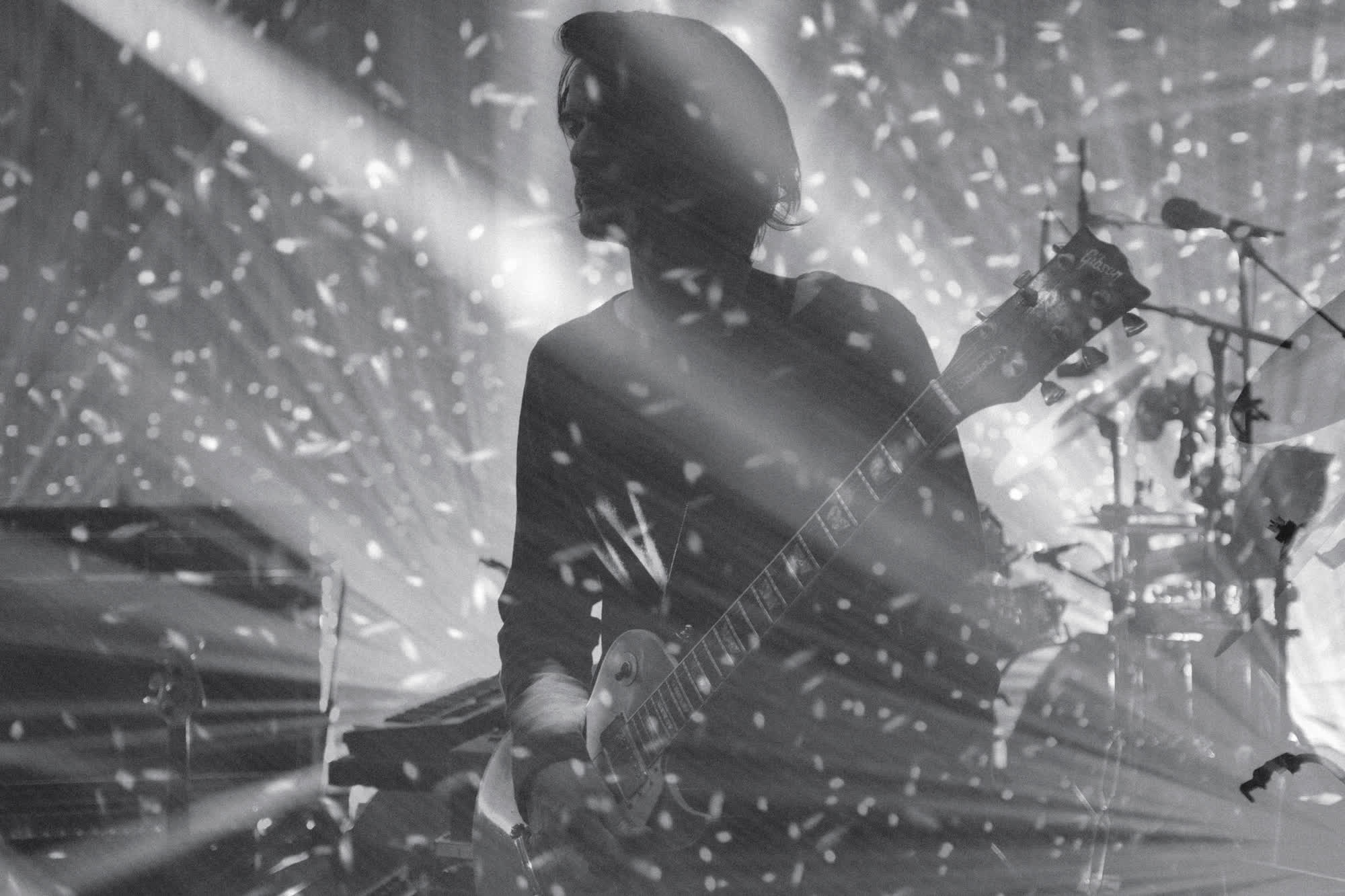 Greenwood’s brother and bandmate, Jonny Greenwood, performs onstage in Dublin, Ireland, in 2018. Photos such as this feature the “random chaos of all the lights and the noise” of the band’s live performances, the photographer said.