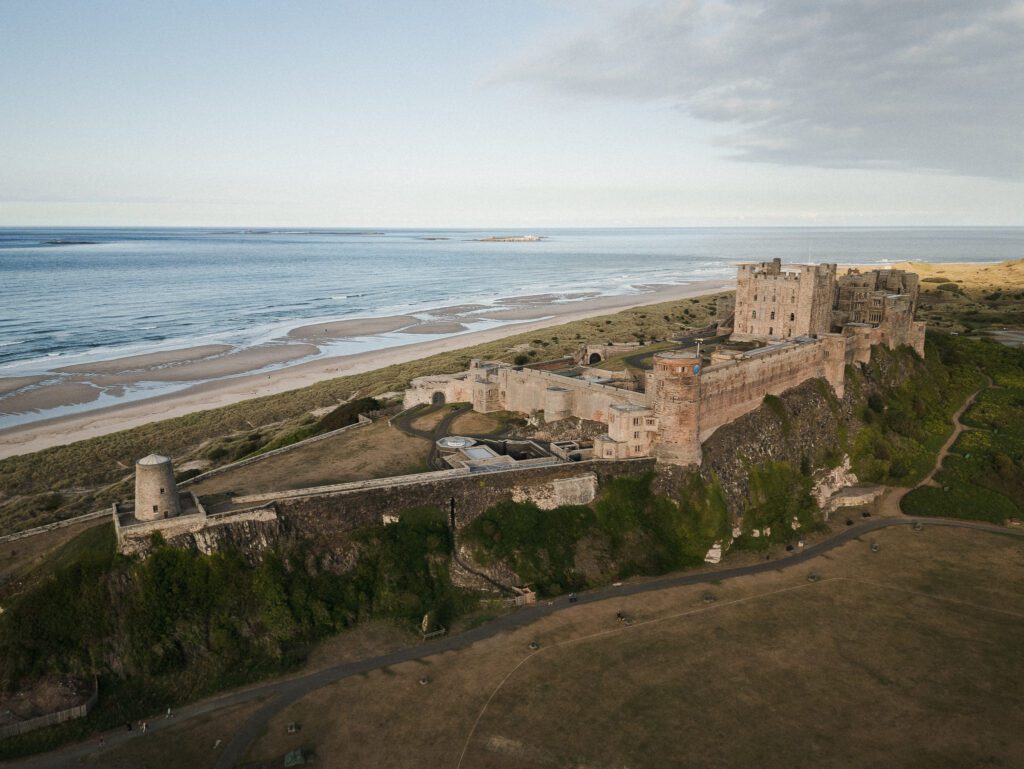 Drone photograph of Bamburgh Castle, Northumberland at sunset