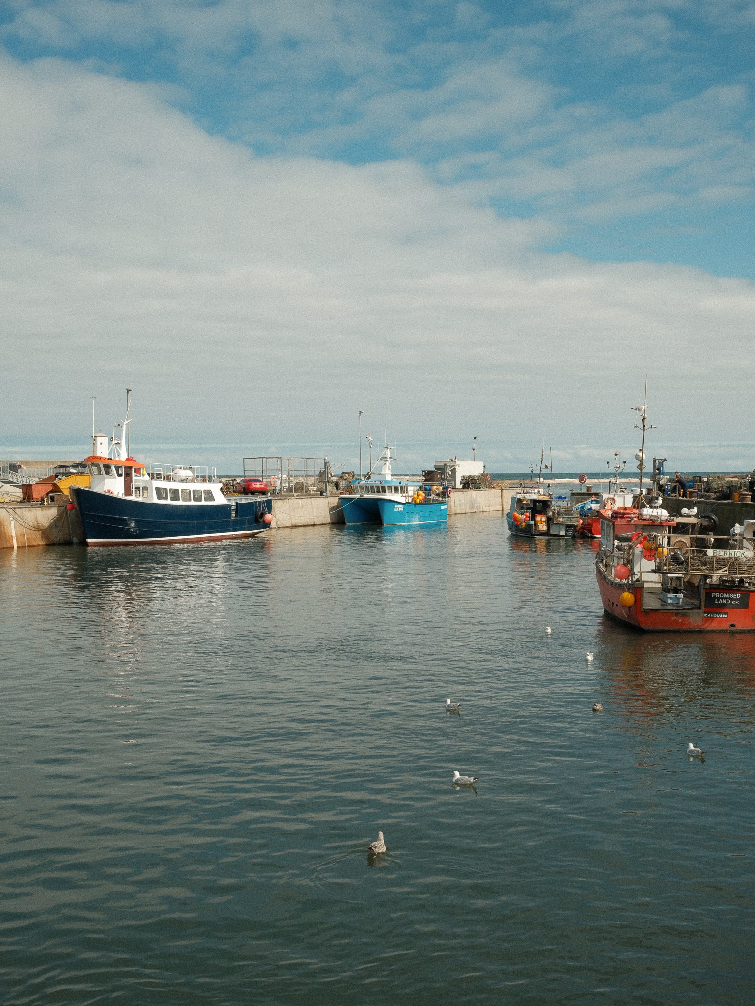 Vibrant fishing boats at Seahouses harbour, Northumberland - Shot on Fujifilm X100VI