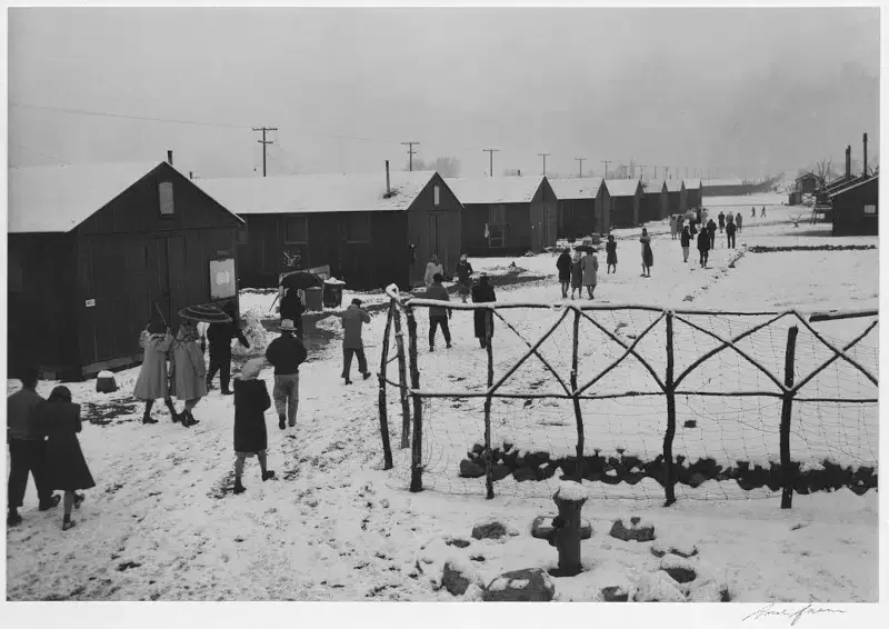 People leaving Buddhist church, winter, Manzanar Relocation Center, California ©️ Ansel Adams